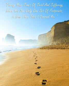 God's set of footprints on beautiful beach with words indicating he was carrying you during your times of trouble.