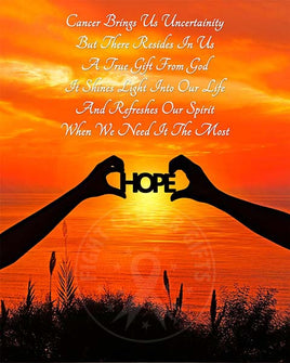Two silhouetted arms holding the word "HOPE" with a brilliant orange sunset over a lake.